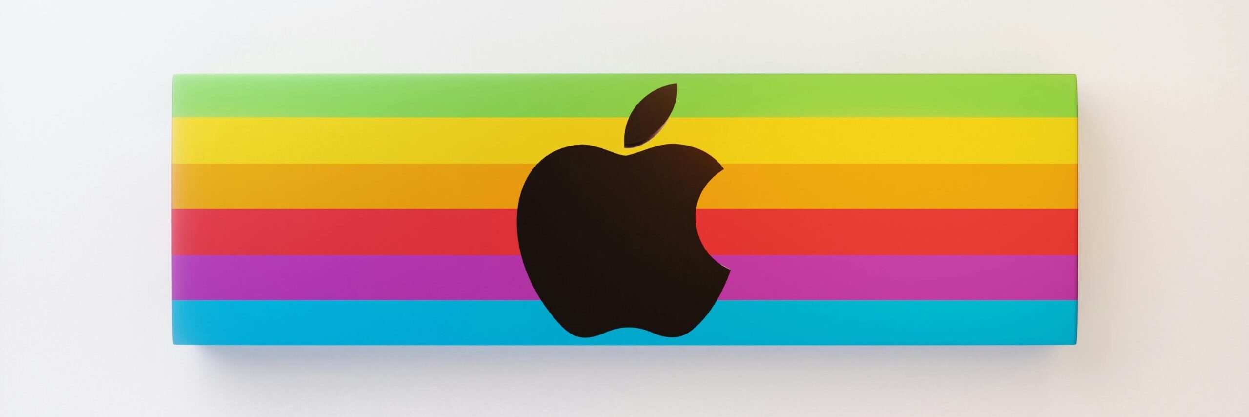 Vibrant Apple logo design featuring rainbow colors on a white background.